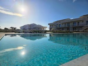 Bilocale in resort con piscine