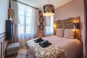 Maisons de vacances La Maison D-Ambre - Jacuzzi - Sauna- Clim : photos des chambres