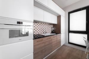 Apartment with private terrace by NEARTO PL