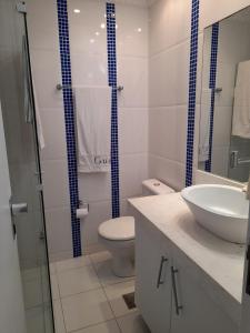 Flat charmoso com vista parcial ao mar