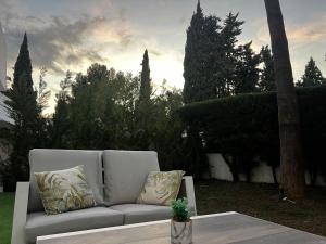 Impeccable large apartment with immense terrace and private garden overlooking the mountain, featuring 2 bedrooms and sleeping up to 4 guests located 100 meters from Plaza Maestranza