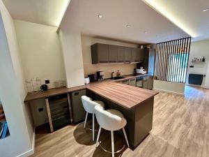 Villas La Ferme de Gabriela, logement haut de gamme dans le Jura : photos des chambres