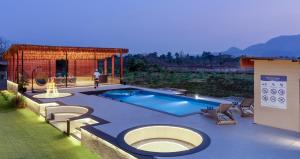 SaffronStays Episode - 5BR pet-friendly pool villa with themed rooms, cabana, bonfire & turf for sports near Karjat River