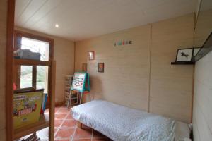 Maisons de vacances Le petit belvedere chalet avec piscine & vue lac : photos des chambres