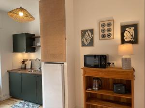 Appartements Le Nid Cosy, studio : photos des chambres