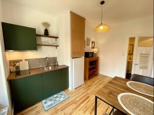 Appartements Le Nid Cosy, studio : photos des chambres