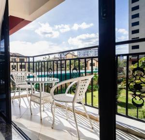executive vibrant view three bedroom apartment with swimming pool,mordern equipped gym free parking space and, child play area and comforting rooftop with city views in kilimani