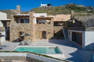 Stone villa with a sea water swimming pool and a sea and sunset view