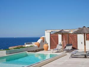 Stone villa with a sea water swimming pool and a sea and sunset view