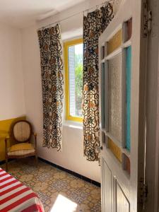 Maisons de vacances La Maison Rose I Maison de village familiale : photos des chambres