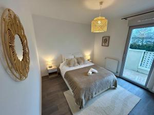 Appartements T2 Cosy proche centre-ville - Balcon - Parking : photos des chambres