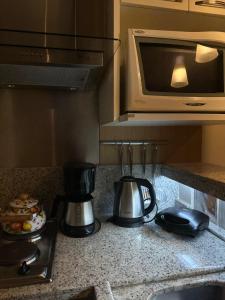 Flat Luxo 3010 com banheira Mountain Village Laje de Pedra Canela