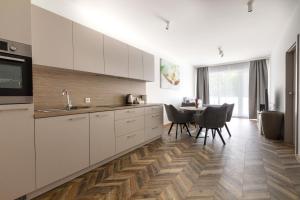 Grey Harmony Apartment by UniqueRent