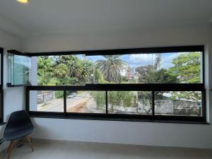 3 min Praia Grande, 2 suítes, Ar Condicionado, Churrasqueira e Piscina no Rooftop