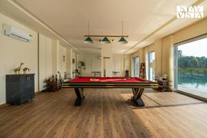 StayVista at Aarna Estate with library, lawn