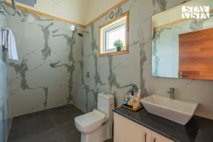 StayVista at Aarna Estate with library, lawn