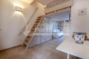 Monolocale mansardato sulla spiaggia di Porto Faro