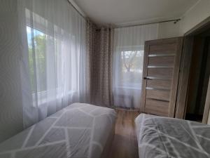 Nakvynė Akmenėje -Pušyno pašonėje