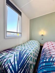 Maisons de vacances Charmant Bungalow Neuf Terrasse Jardin au calme : photos des chambres