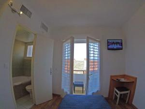 Hotels Les Palmiers : photos des chambres