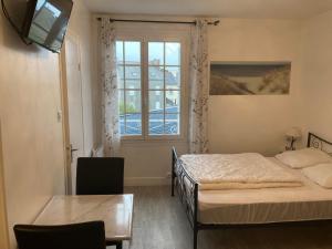 Appartements Un cocon en bord de mer : photos des chambres
