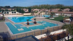 Villas Villa climatisee dans residence LES TAMARIS, 3 chambres, veranda, Wifi, a 400m de la plage de Portiragnes LRTAMG15 : photos des chambres