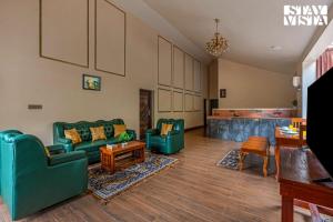 StayVista at Ambrosia access to water stream