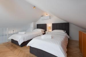 APARTMENTS BRUNO 1&2 - two-room penthouse apartments - wonderful panoramic view of the sea - the best location, first row to the beach - 10 minutes from Supetar ferry port - free secured parking - facilities nearby