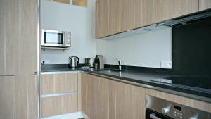 Appartements Little Suite - Alix : photos des chambres