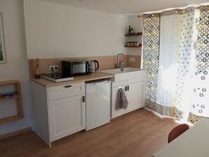 Appartements L-Olivier, appartement cosy entre mer et foret : photos des chambres