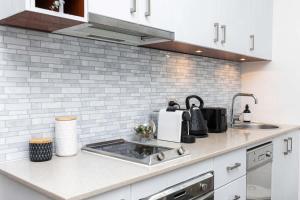 Bright Beachfront Studio with Terrace & Aircon