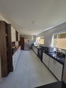 Casa e flat com piscina - Praia da Enseada