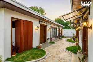 StayVista at The Five Oaks - Private Pool Cottages