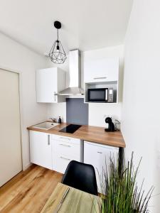 Appartements Studio 2 Cosy en centre-ville - Puy duFou : photos des chambres