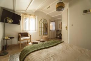 Chalets La Cabane de L-Olivier - Suite cosy avec jacuzzi & home cinema : photos des chambres