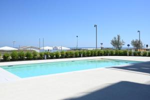 SE125 - Senigallia, esclusivo trilocale fronte mare con piscina