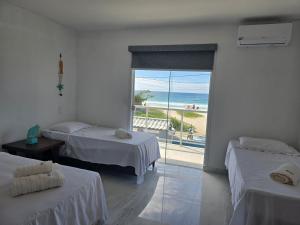 Pé na areia, refúgio beira-mar