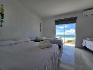 Pé na areia, refúgio beira-mar