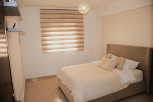 Appartement lumineux 2 chambres clim, Wi-Fi, parking proche corniche Tanger