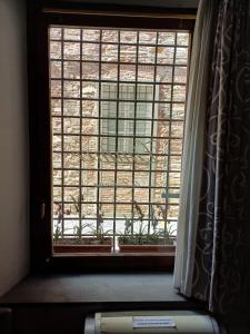 Quadruple Room - Ground Floor, Street View room in La Colonna (Historic Centre)