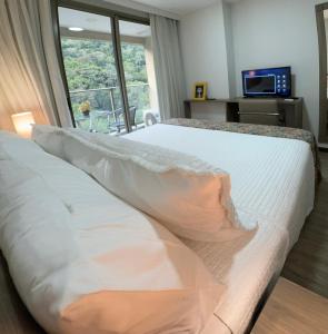 Suíte Econômica com Conforto de Luxo Próxima à Praia e aos Eventos