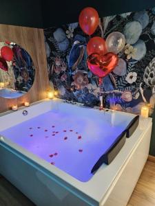 Appartements Suite Passion - Jacuzzi prive - Table massage : photos des chambres