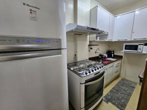 Apartamento em frente ao mar, pé na areia.