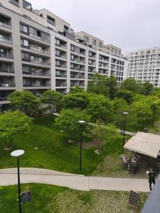 Cozy Urban Residence Studio - balcony with garden view