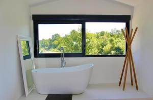 Maisons de vacances Le clos des berges de l-Ain : photos des chambres
