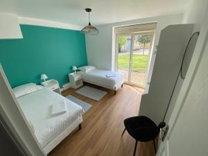 Maisons de vacances Aux Premieres Loges - Gite de charme proche du circuit : photos des chambres