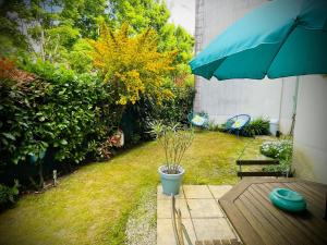 Appartements La Clef du Bonheur - 9 Min de Disney Jardin privatif : photos des chambres