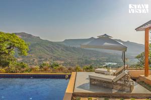 StayVista at Villa Eleve with Bonfire, Pool & Gazebo