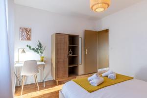 Appartements Le Boho - Charmant T3 avec climatisation et fibre : photos des chambres