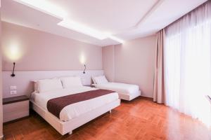 Superior Triple Room with Balcony and Side Sea View room in Hotel Apollon